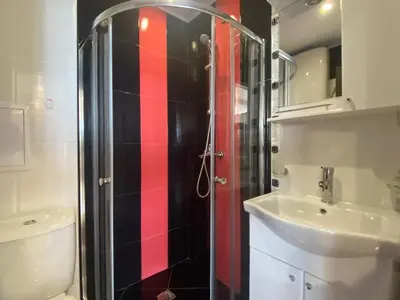 a bathroom with a shower and a toilet and a sink at PARADISO 'В' 607 Large Luxury Apartment in Nesebar