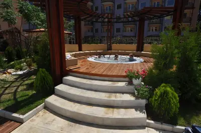 a courtyard with a fountain in a building at Harmony Suites Jungle - Family Friendly Complex in Sunny Beach
