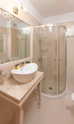 a bathroom with a sink and a shower at Harmony Suites Jungle - Family Friendly Complex in Sunny Beach