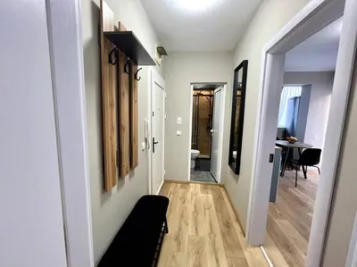 a hallway with a hallway leading to a room at Sea Garden Apartment in Burgas City
