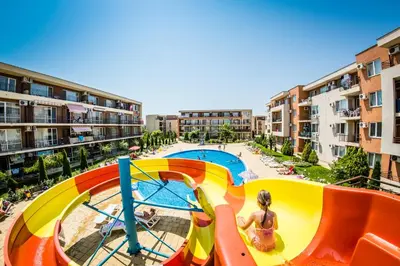 an image of a water slide at a apartment complex at Waterpark Fort Apartments in Sunny Beach