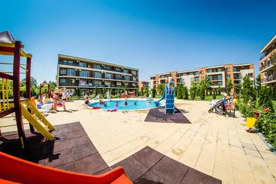 a playground with a pool with people playing in it at Waterpark Fort Apartments in Sunny Beach