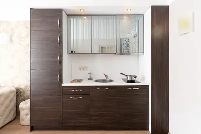a bathroom with a sink and a wooden cabinet at Harmony Palace in Sunny Beach