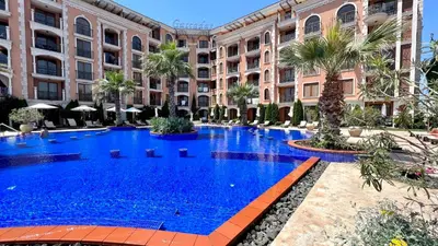 a large swimming pool in front of a building at Bratanov Cascadas Ravda in Ravda