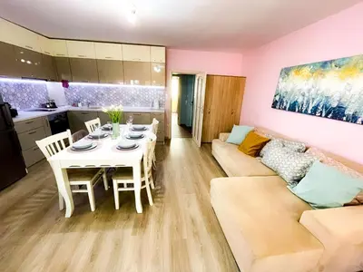 a living room with a table and a couch at Top Location !!FREE parking!! 