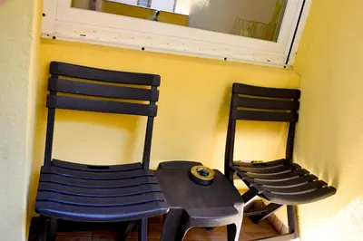 two chairs sitting next to a table and a mirror at Top Location !!FREE parking!! 