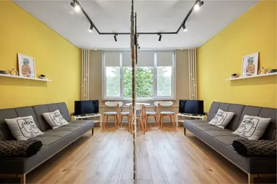a living room with two couches and a table at LAZUR first line in Burgas City