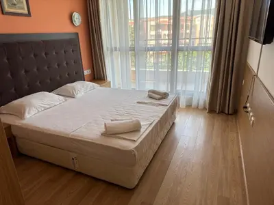 a bedroom with a bed with two towels on it at PACIFIC-3-A in Sunny Beach