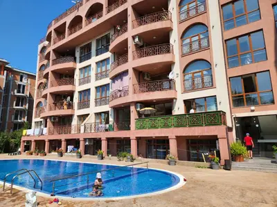 an apartment building with a swimming pool in front of it at PACIFIC-3-A in Sunny Beach