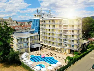 an aerial view of a hotel with chairs and umbrellas at Sol e Mar in Sunny Beach