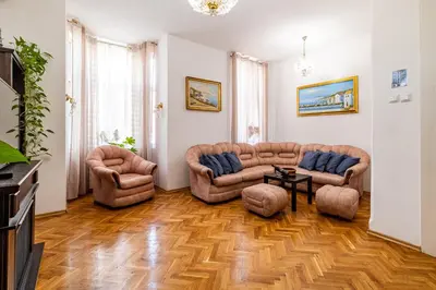 a living room with two couches and a table at Aristocratic 2bdrm Central Apartment in Varna City