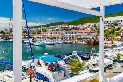 a view of a marina with boats in the water at Panorama Bay 2 - Apartments by the beach in Sveti Vlas