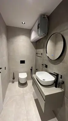 a bathroom with a toilet and a sink and a mirror at Amber Home - brand NEW luxury 1 bedroom apartment located in the very city center in Varna City