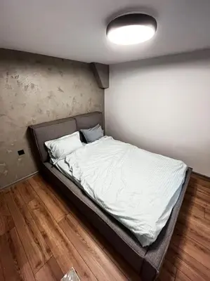 a large bed in a room with appelin at Amber Home - brand NEW luxury 1 bedroom apartment located in the very city center in Varna City