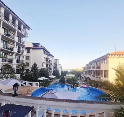 a view of a swimming pool in front of some buildings at Apartment Almi - The Cliff Obzor in Obzor