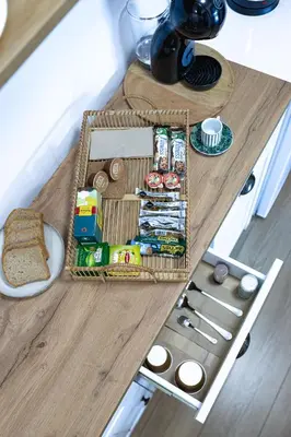 a table with a basket of food on top of it at Луксозен Апартамент в Модерна сграда -Молимаркс Делукс Апартамент Бургас in Burgas City
