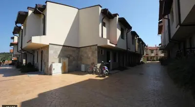 a bike parked in front of a building at Dream Villa in Imperial Heights Villas in Sunny Beach