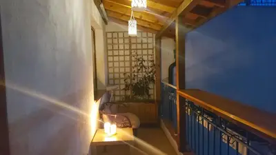 a hallway with a table and candles in a room at COCO Coworking & Coliving in Aheloy