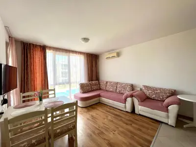 a living room with a couch and a table at Апартамент Атлантик Бяла - Apartment Atlantic Byala in Byala
