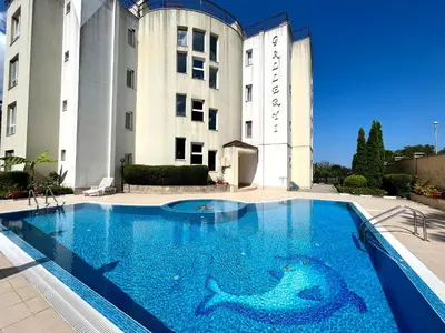 a large swimming pool in front of a building at Студио Галерия - Studio Galeria in Byala