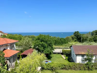 a group of houses with the ocean in the background at Студио Галерия - Studio Galeria in Byala