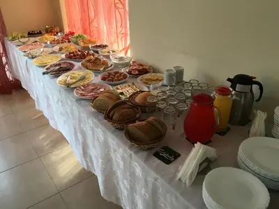 a long table with many different types of food on it at Beatris Family House in Sunny Beach