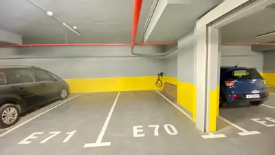 a parking garage with two cars parked in it at Arena MALL Galleria View and Securities Parking1 in Burgas City