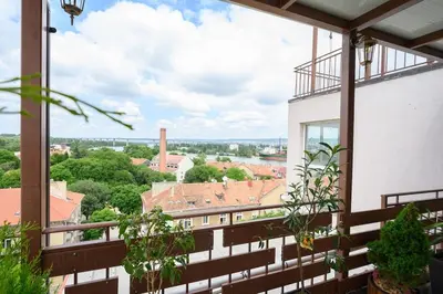 a balcony with a view of a city at Sunset Luxury Apartment in Varna City
