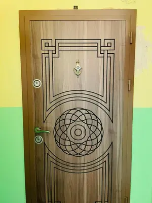a wooden door with a symbol on it at Просторен апартамент in Varna City