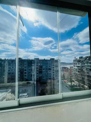 a view of a city from a window at Просторен апартамент in Varna City