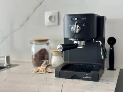 a black coffee maker sitting on a kitchen counter at Arena MALL Galleria View and Securities Parking2 in Burgas City