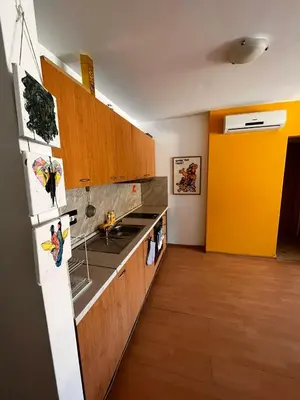 a kitchen with a sink and a refrigerator at Sozopolis Hills - B1 - 3-room apart - 10 min from the beach in Sozopol