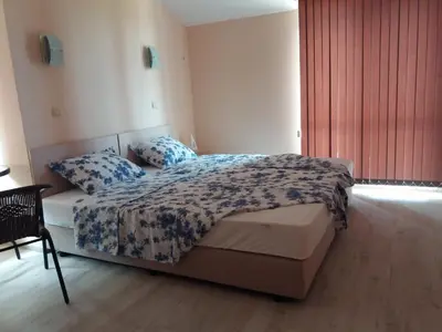 a bedroom with a bed with two pillows on it at Апартамент в комплекс Зора 9A in Sozopol