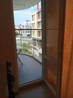 a door leading to a balcony with a view at APARTMENT 8 Primorsko АПАРТАМЕНТ 8 Приморско in Primorsko