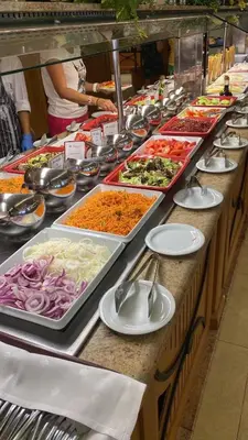 a buffet line with many different types of food at Sunny Majestic Private Apartment in Sunny Beach