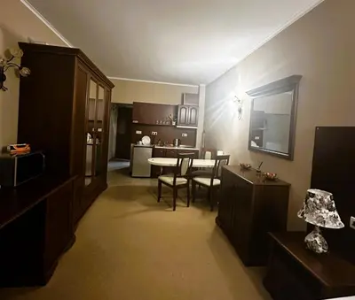 a kitchen and living room with a table and chairs at Studio Festa Pomorie in Pomorie