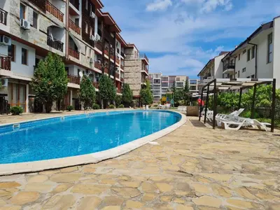 a swimming pool in the middle of a building at MitProt Panorama Bay 2 Studio 206 in Sveti Vlas