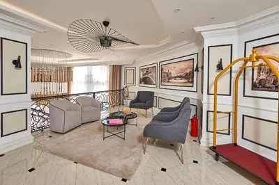 a living room with two chairs and a table at Florance Rentals Luxury Apartments in Saint Vlas in Sveti Vlas