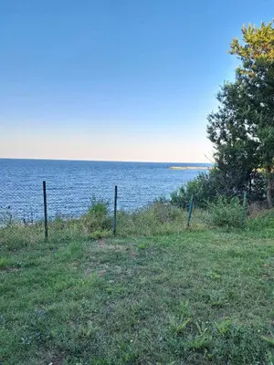 a field with a view of a body of water at Комплекс Джулай Морнинг in Kiten