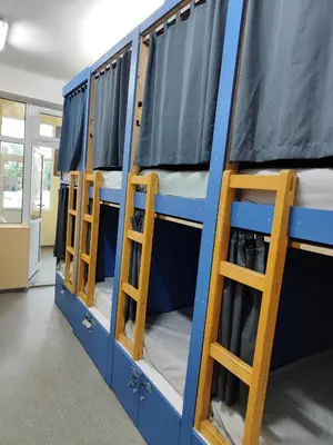 a group of bunk beds in a room at ЛИДЕР ХАУС ХОСТЕЛ in Varna City