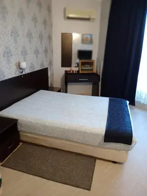 a bedroom with a bed in a room at Apartment with sea view in Sunny Beach