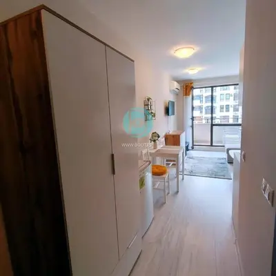 a hallway with a door leading to a living room at U Dacha - Premium Apartments in Sunny Beach