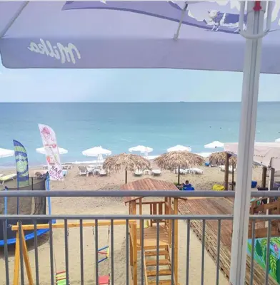 a view of a beach with umbrellas and the ocean at Villa Sea House 2 in Byala