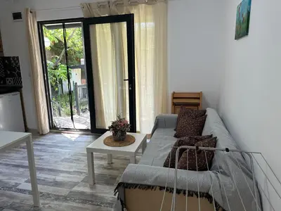 a living room with a couch and a table at Villa Sea House 3 in Byala