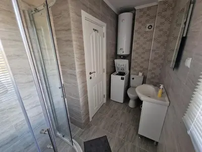 a bathroom with a shower and a toilet and a sink at Premium 2 bedroom flat at Millennium 2 in Sveti Vlas