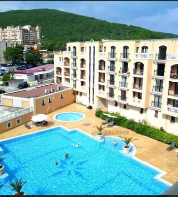 a large swimming pool in front of a building at Villa Astoria 5. Sveti Vlas k.k. Elenite in Sveti Vlas