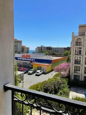 a balcony with a view of a parking lot at Villa Astoria 5. Sveti Vlas k.k. Elenite in Sveti Vlas