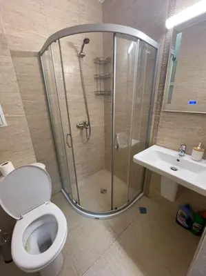 a bathroom with a shower and a toilet and a sink at k.k Elenite Vila Astoria 5 in Sveti Vlas