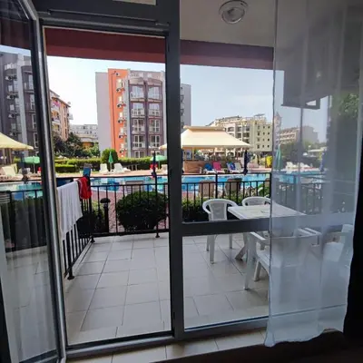 a balcony with a view of a pool and buildings at Sunset Beach 3 - Apartments in Sunny Beach