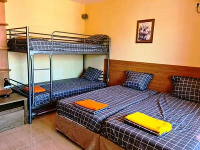 a bedroom with two bunk beds and a desk at апартамент под наем на първа линия море in Sozopol